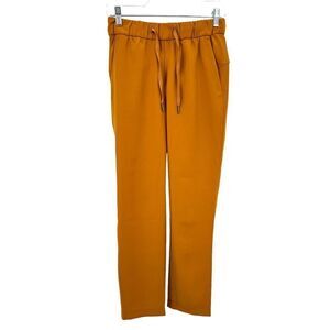 Lululemon On the Fly 7/8 Pant Woven Vintage Gold Mustard Yellow Women’s Size 4